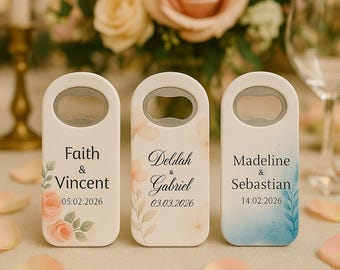May include: Three white bottle openers with floral designs and personalized names and dates. The bottle openers have a silver bottle opener on the front. The first bottle opener has a peach floral design and says "Faith & Vincent 05:02:2026". The second bottle opener has a peach floral design and says "Delilah & Gabriel 03.03.2026". The third bottle opener has a blue watercolor design and says "Madeline & Sebastian 14:02:2026".