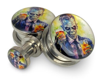 May include: A pair of stainless steel ear gauges with a zombie drinking a beer design. The gauges are 1/2 inch in diameter.