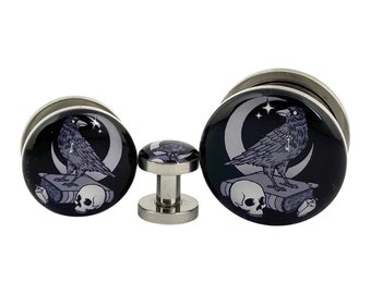 The Raven Picture Plugs (MTO-034) gauges - 16g, 14g, 12g, 10g, 8g, 6g, 4g, 2g, 0g, 00g, 1/2, 9/16, 5/8, 3/4, 7/8, 1 inch