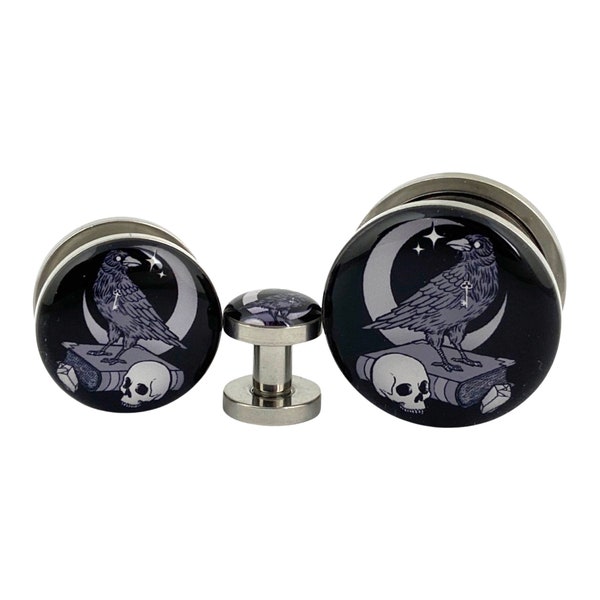 The Raven Picture Plugs (MTO-034) gauges - 16g, 14g, 12g, 10g, 8g, 6g, 4g, 2g, 0g, 00g, 1/2, 9/16, 5/8, 3/4, 7/8, 1 inch