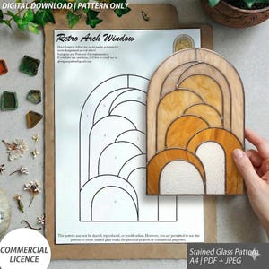 May include: A stained glass pattern in an arch design with a retro style. The pattern is on a white sheet of paper with the text "Retro Arch Window". The pattern is accompanied by a finished stained glass piece in shades of orange and cream. The image also includes the text "DIGITAL DOWNLOAD | PATTERN ONLY".