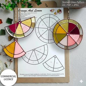 May include: Stained glass patterns in a citrus fruit theme. The image shows three stained glass pieces in the shape of orange and lemon slices, with a variety of colours. A paper with the text "Orange and Lemon" and "Stained Glass Pattern" is in the background.
