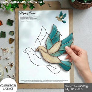 May include: A stained glass pattern featuring a dove design, with teal and cream-colored glass pieces. The pattern is on a white sheet with the text "Flying Dove" and "DIGITAL DOWNLOAD | PATTERN ONLY". Includes a commercial license.
