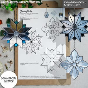 May include: A digital download stained glass pattern for a snowflake design, featuring A4 PDF and JPEG files. The document includes line art templates labelled with letters, alongside three finished glass star ornaments in blue and clear tones.