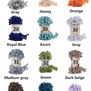 May include: A collection of colorful yarn skeins in various shades, including gray, honey, orange, royal blue, azure, medium gray, green, dark beige, chocolate, petrol, and lilac. Each skein is labeled with a number from 25 to 36.