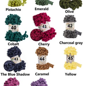 May include: A collection of colorful yarn skeins in various shades, including pistachio, emerald, olive, cobalt, cherry, charcoal gray, caramel, yellow, dark pink, and lavender. Each skein is labeled with a number and color name.