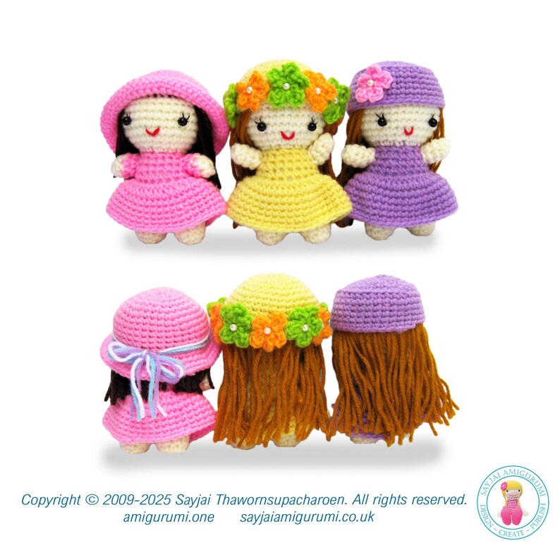 May include: Four crocheted dolls with different colored dresses and hats. The dolls have brown hair and are standing in a row. The dolls are wearing pink, yellow, purple, and pink dresses. The dolls are wearing pink, yellow, purple, and pink hats.