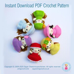 May include: Six crocheted dolls with different colored dresses and hats. The dolls are arranged in a circle on a white background. The dolls are all wearing different colored dresses and hats. The dolls are all smiling.