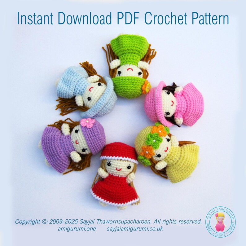May include: Six crocheted dolls with different colored dresses and hats. The dolls are arranged in a circle on a white background. The dolls are all wearing different colored dresses and hats. The dolls are all smiling.