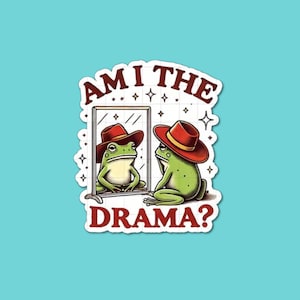 May include: A sticker featuring a green frog wearing a red cowboy hat, looking in a mirror at its reflection. The text "AM I THE DRAMA?" is above and below the mirror. The sticker has a white border and is set against a teal background.