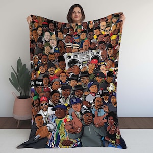 May include: A colorful blanket featuring a collage of illustrated hip-hop artists. The design includes a boombox and the text "Hip Hop" and "@BeddoArt". The blanket is held up by a person.