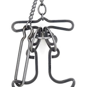 May include: A metal anchor puzzle with a chain attached to the top. The puzzle is made of several interlocking pieces that can be manipulated to create different shapes.