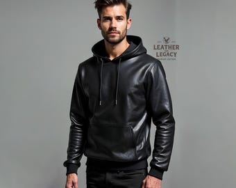 May include: A black leather hoodie with a drawstring hood and a kangaroo pocket. The hoodie has a black zipper and a black lining. The text "LEATHER & LEGACY" is printed on the right side of the hoodie.