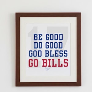 May include: Framed print with the words "BE GOOD DO GOOD GOD BLESS GO BILLS" in blue and red block letters. The print is in a brown frame with a white mat.
