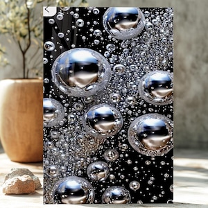 May include: Abstract art print featuring a black background with numerous silver, reflective orbs of varying sizes. The orbs create a 3D effect, with some appearing to float. The artwork has a modern, minimalist aesthetic, suitable for home decor.