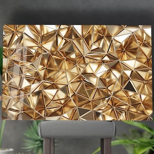 May include: A golden, geometric wall art piece featuring a complex pattern of triangular shapes. The artwork has a reflective, metallic finish, creating a dynamic interplay of light and shadow. The overall design is abstract and modern.