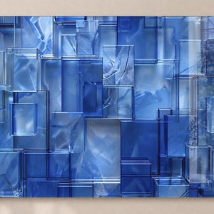 Puede incluir: Impresi&oacute;n art&iacute;stica abstracta con un dise&ntilde;o geom&eacute;trico de bloques de vidrio azules superpuestos. La obra de arte tiene un efecto 3D con diferentes tonos de azul y elementos transparentes, creando profundidad e inter&eacute;s visual. El tema general es moderno y arquitect&oacute;nico.