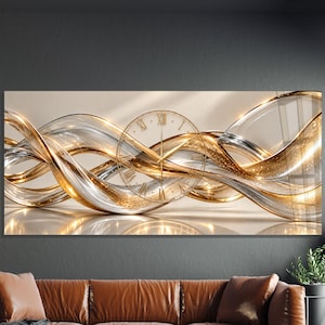 May include: A rectangular wall clock featuring a central circular face with Roman numerals and thin gold hands, overlaid on a horizontal abstract design of flowing, intertwined ribbons in metallic gold and silver with a glossy finish.