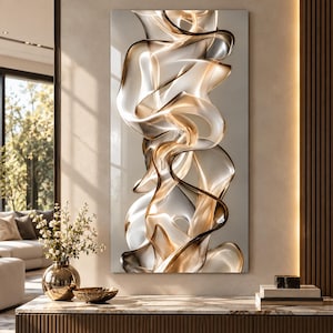 May include: A vertical rectangular wall art piece featuring abstract, flowing, translucent ribbons in shades of gold, bronze, and white. The composition creates a sense of movement with layered, curved shapes that overlap and twist, set against a neutral, light-coloured background.
