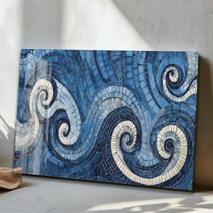 May include: A rectangular mosaic artwork featuring a swirling wave design. The artwork uses shades of blue and white tiles to create the ocean wave pattern. The mosaic is mounted on a wooden frame, adding depth and texture to the piece.