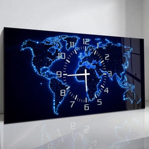 May include: A rectangular wall clock featuring a world map design with a blue and black color scheme. The map is outlined with glowing blue lines, and a white clock face is superimposed over the map. The clock hands are white.