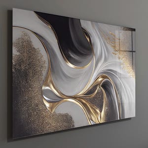 May include: Abstract wall art with swirling patterns in grey, black, and white, highlighted by gold metallic accents. The artwork has a glossy finish and is mounted on a grey wall.