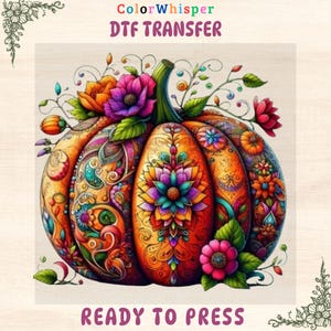 Peut inclure: Une citrouille conçue numériquement avec des motifs floraux complexes et le texte "DTF TRANSFER" et "READY TO PRESS". La citrouille est principalement orange avec des accents de jaune, de violet et de vert, et est ornée de fleurs et de feuilles.