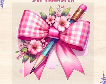 May include: A digital DTF transfer design featuring a pink gingham bow, a pencil, and pink flowers. The words "DTF TRANSFER" and "READY TO PRESS" are displayed in pink text. The design has a watercolor style.