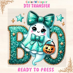 May include: A teal and gold glitter "BOO" design with a cute ghost character holding a jack-o'-lantern. The ghost wears a teal bow and dress. The design includes stars and the text "ColorWhisper DTF TRANSFER READY TO PRESS."