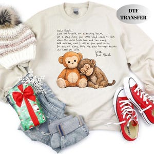 May include: Cream-colored sweatshirt with a graphic of two plush monkeys and the text "Dear Punch, I am not breath..." Red Converse sneakers and a winter hat are also in the image.