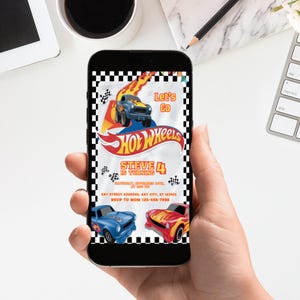 May include: A smartphone displays a Hot Wheels-themed birthday invitation. The design features a blue and yellow race car with flames, the Hot Wheels logo, and the text "Let's Go." The invitation is for Steve's 4th birthday.
