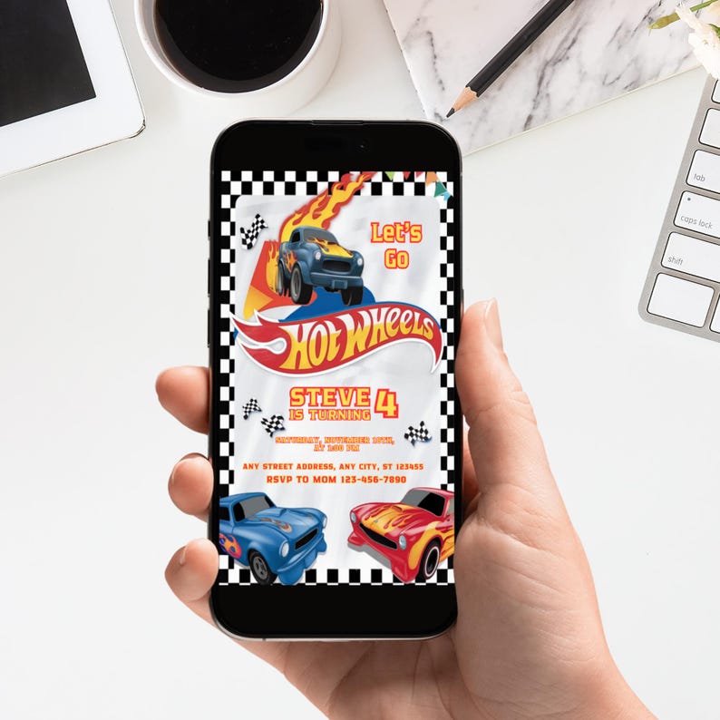 May include: A smartphone displays a Hot Wheels-themed birthday invitation. The design features a blue and yellow race car with flames, the Hot Wheels logo, and the text "Let's Go." The invitation is for Steve's 4th birthday.