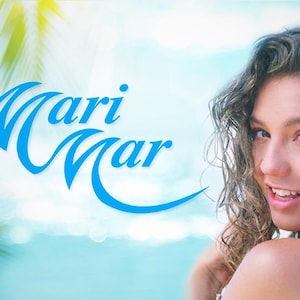 May include: A woman with long, curly hair smiles at the camera. The background is a blurred image of a beach with blue water and a palm tree. The text "Mari Mar" is written in blue cursive letters.