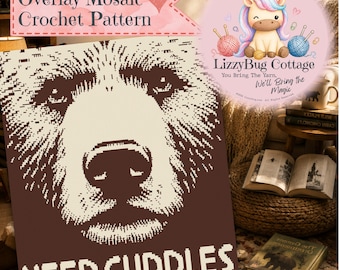 May include: An overlay mosaic crochet pattern featuring a brown and cream bear face graphic with the text "NEED CUDDLES" at the bottom. The design includes a pink circular logo with a unicorn illustration and the text "LizzyBug Cottage".