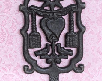 Vintage Cast Iron 3D Trivet Marked J.Z.H. 1951 With Two Brooms , Hearts and Birds - Star on Top