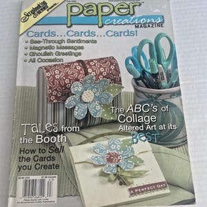 May include: A magazine cover for "Paper Creations Magazine" with the headline "Cards...Cards...Cards!" showcasing paper crafts. The cover features a floral embellishment and text that reads "The ABC's of Collage Altered Art at its BEST."
