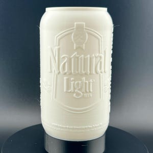 May include: White 3D printed can with the words "Natural Light" embossed on the front.