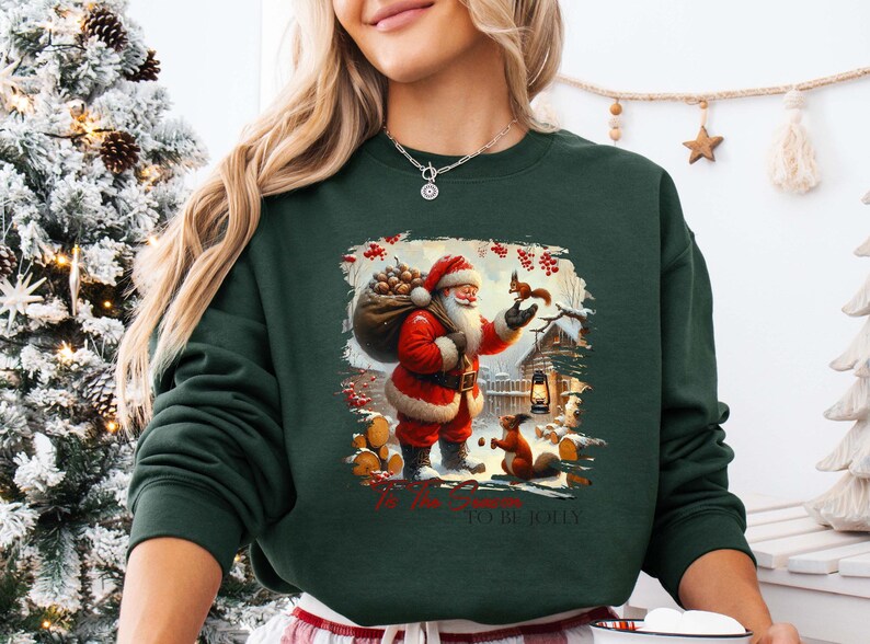 a woman wearing a christmas sweater holding a remote control