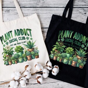 two bags with plants on them sitting on a table
