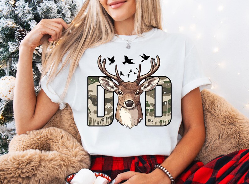 a woman wearing a t - shirt with a deer on it