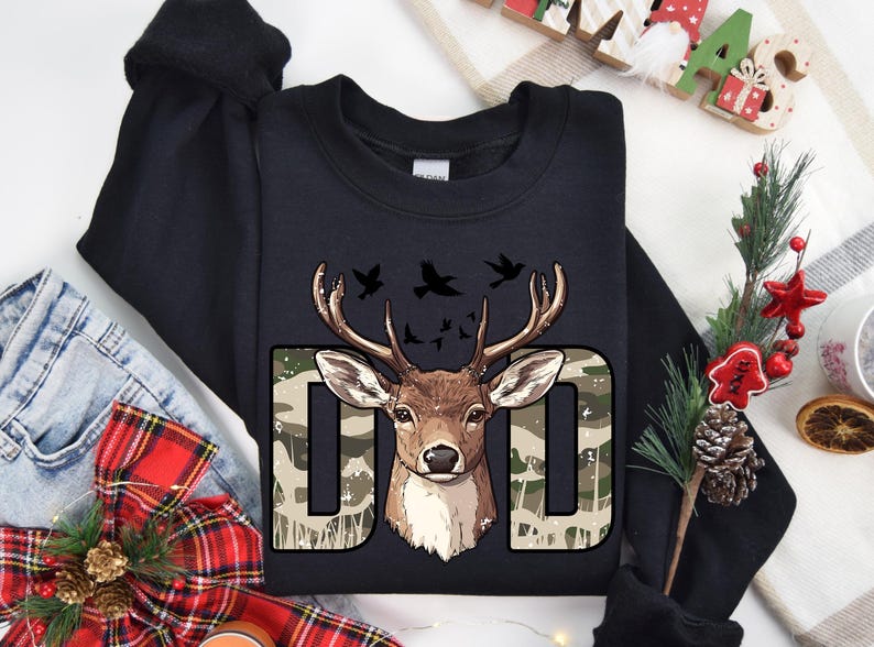 a black t - shirt with a deer head on it