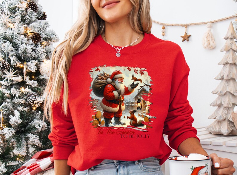 a woman wearing a santa clause sweater holding a coffee mug
