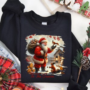 a black shirt with a santa clause on it