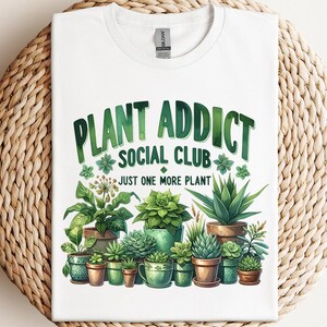 a white t - shirt with a plant advertisement on it