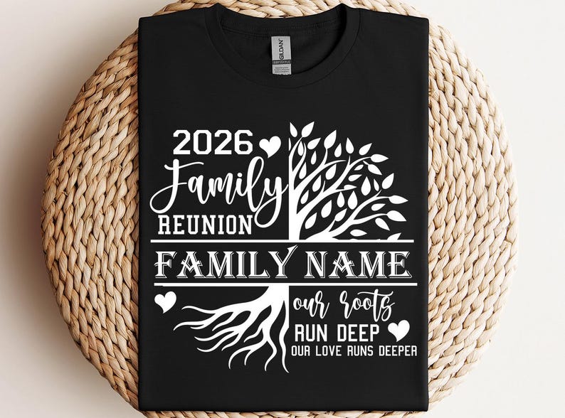 A black t-shirt with a white graphic design featuring a tree with roots and the text "2026 Family Reunion Family Name our roots run deeper".
