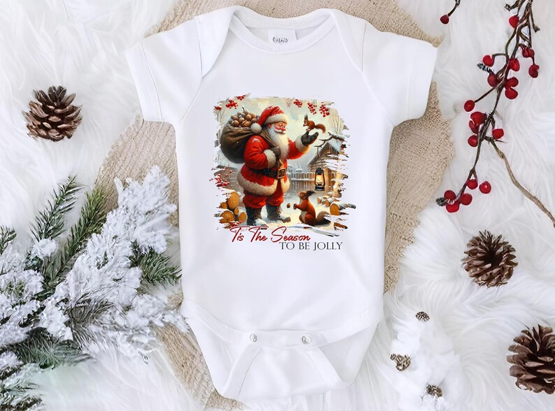 a white baby bodysuit with a santa clause on it