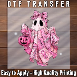 May include: A pink ghost-like figure with a bow, holding a jack-o'-lantern, and draped in a patchwork of pink fabric with breast cancer awareness ribbons and words like "Hope" and "Strength". The text "DTF TRANSFER" and "Easy to Apply - High Quality Printing" are at the top and bottom.