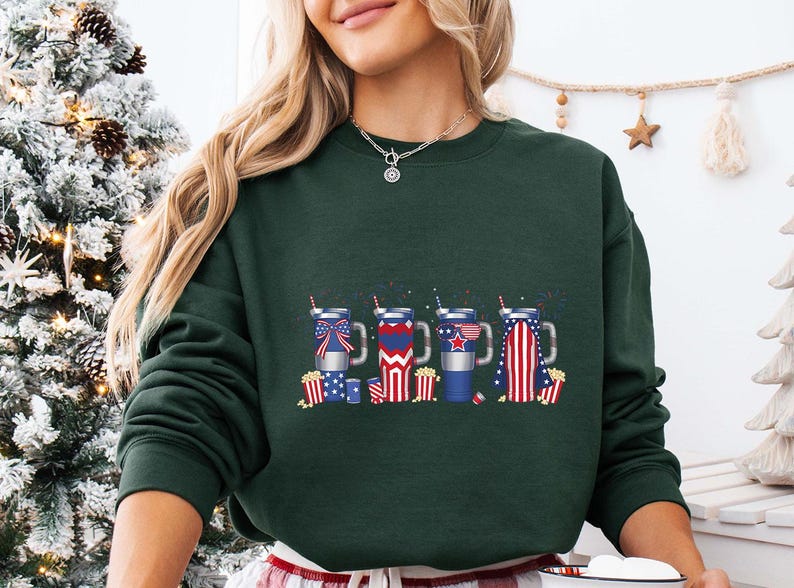 a woman wearing a green sweatshirt with american symbols on it