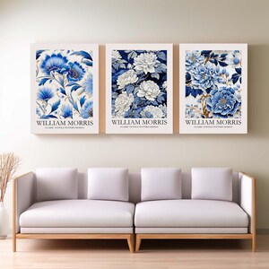 May include: Three framed prints with blue and white floral patterns. Each print features the text "WILLIAM MORRIS" and "CLASSIC TEXTILE PATTERN DESIGN".