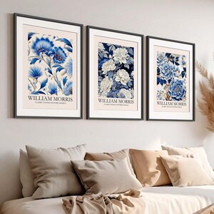 May include: Three framed prints with blue and white floral patterns. Each print features the text "William Morris" and "Classic Textile Pattern Design".